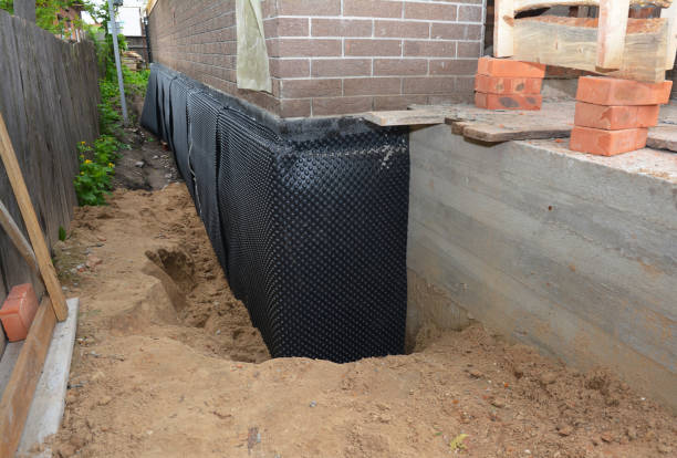 Happy homeowners after waterproofing job in Saint Joseph